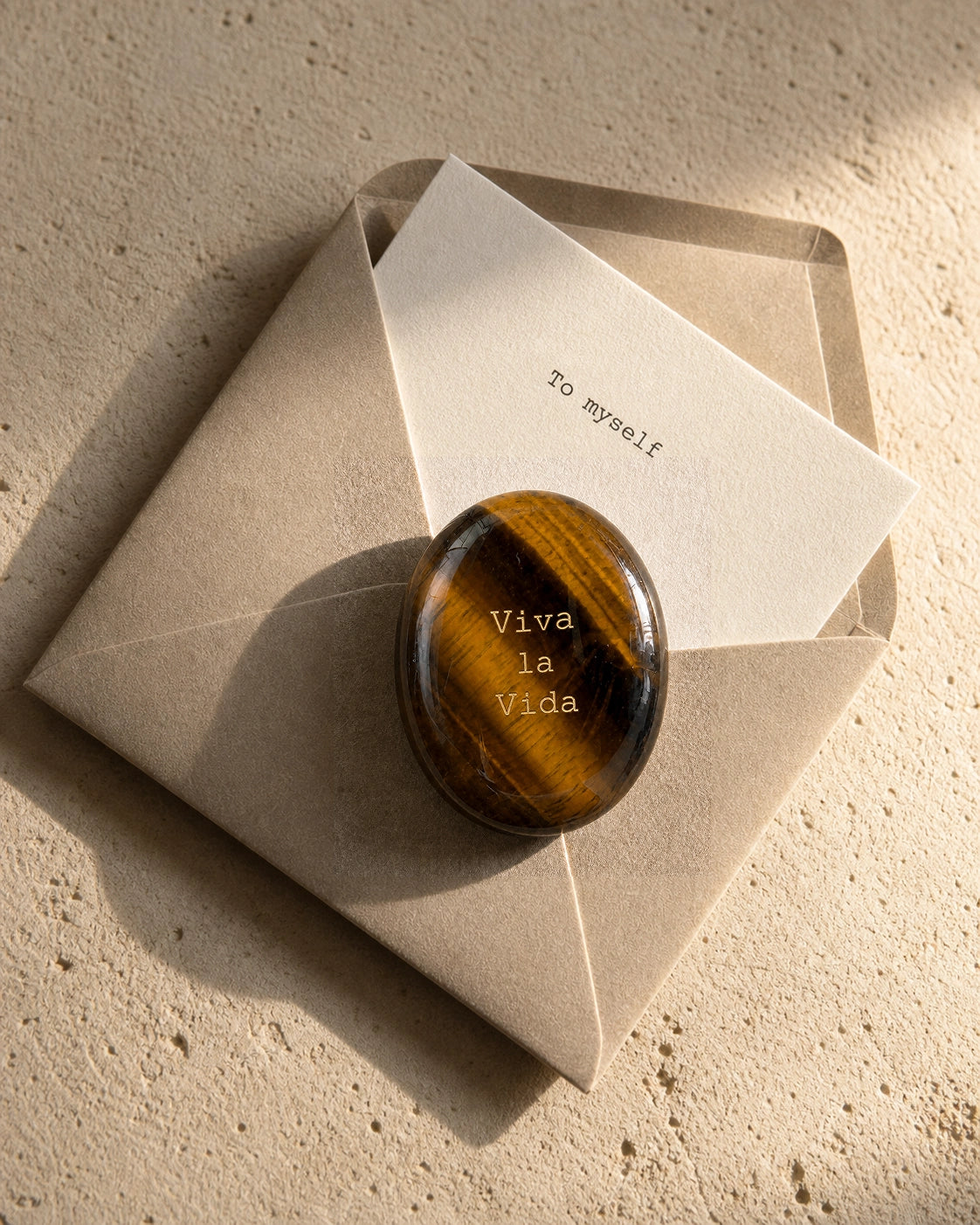 Tiger's Eye engraved with Viva la Vida