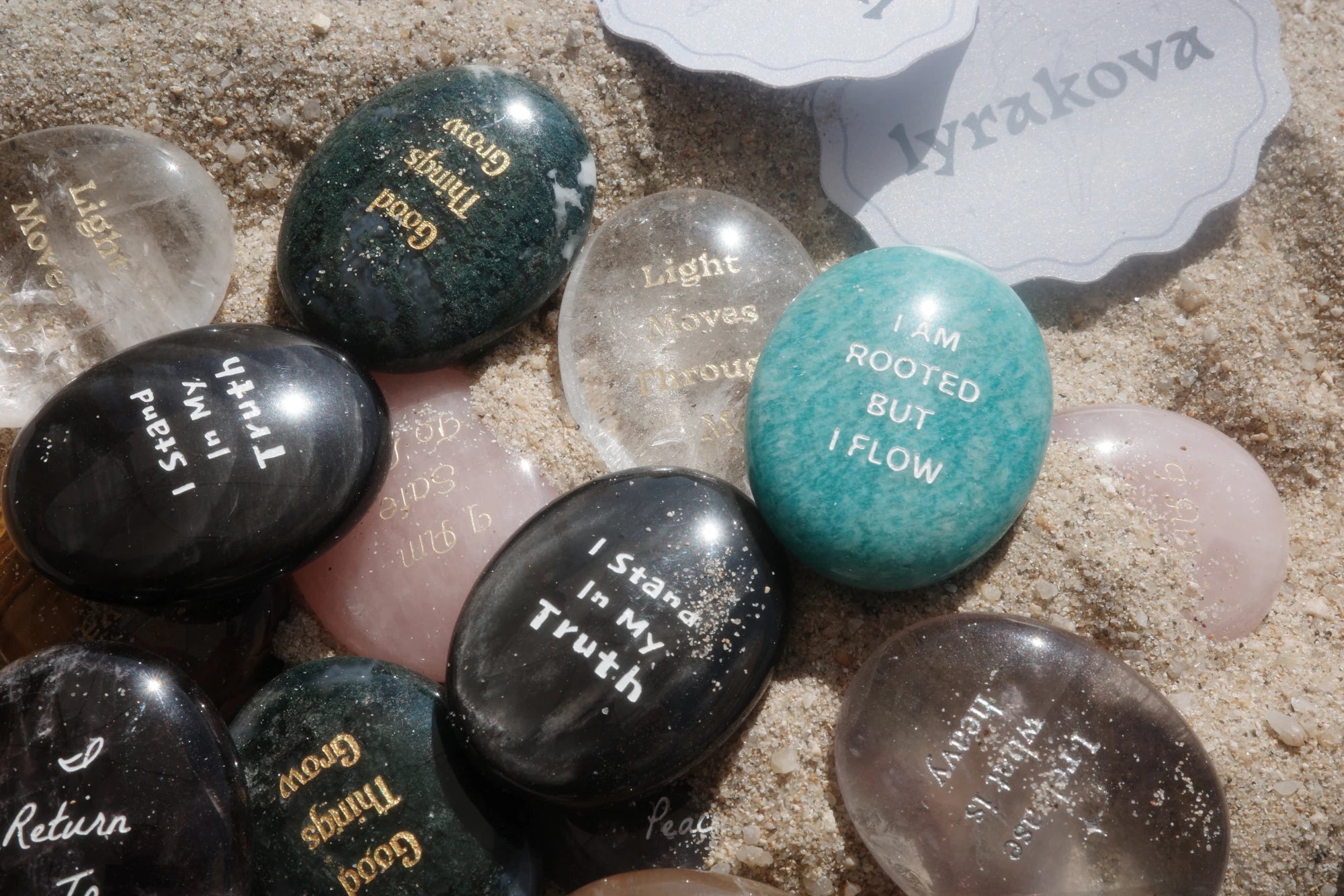 Engraved lyrakova stones arranged with personal message cards