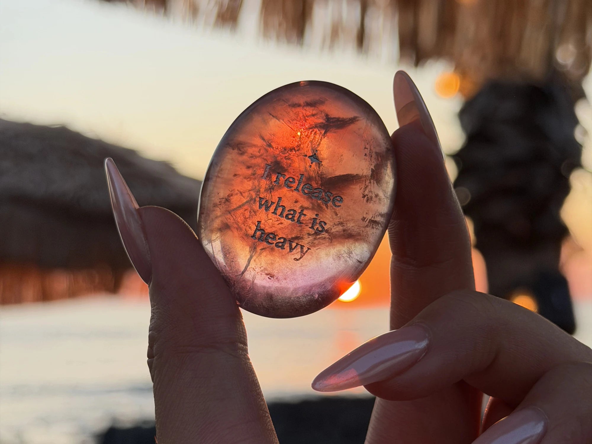 An engraved fluorite stone glowing in sunset light